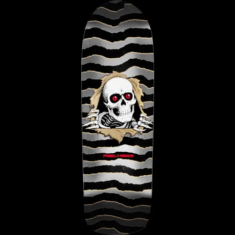 Powell Peralta Ripper Grey skateboard deck: A white skull with red eyes and skeletal hands tears through a torn tan background, on a black and silver-grey wavy striped deck with a Powell Peralta logo below.