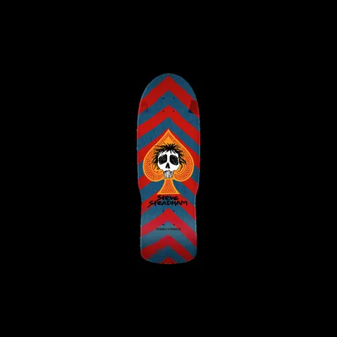 Powell Peralta Steadham Skull and Spade Blem Red/Blue skateboard deck: A wild-haired skull inside an orange spade sits over red and blue chevron stripes on an old-school shaped deck, with the rider's name below in black.