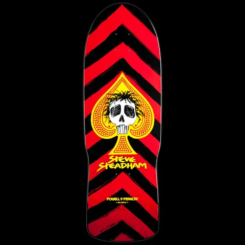 Powell Peralta Steadham Spade Red skateboard deck: A white skull with scruffy black hair sits inside a yellow spade, with Steve Steadham in yellow below, over bold red and black chevron stripes.