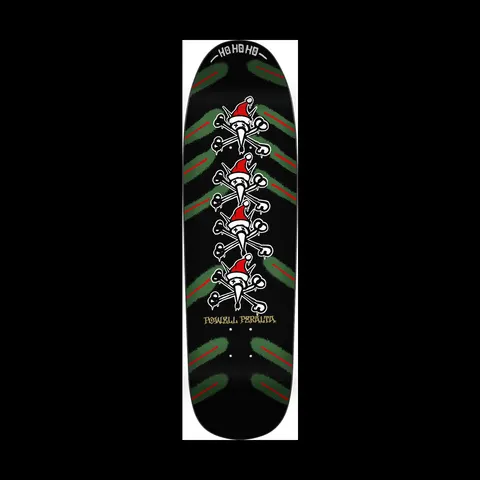 Powell Peralta Xmas Vato Rat Black skateboard deck: Four Vato Rat skull and crossbones figures stacked down the centre, each wearing a Santa hat, over green and red brushed chevron stripes on black. HO HO HO is printed at the nose.