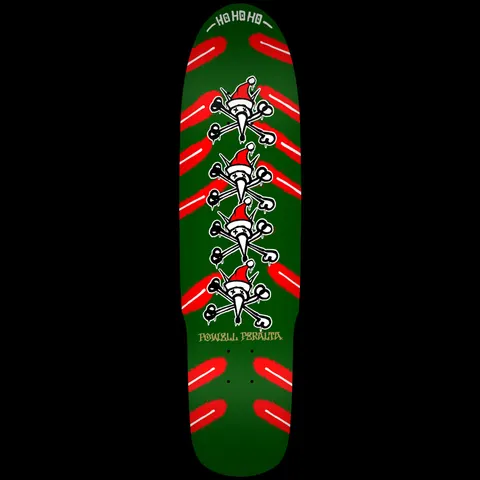 Powell Peralta Xmas Vato Rat Green skateboard deck: Four stacked Vato Rat skull and crossbones figures wearing Santa hats run down the centre of a green deck, flanked by red spray-paint chevron strokes, with a Ho Ho Ho banner at the nose.