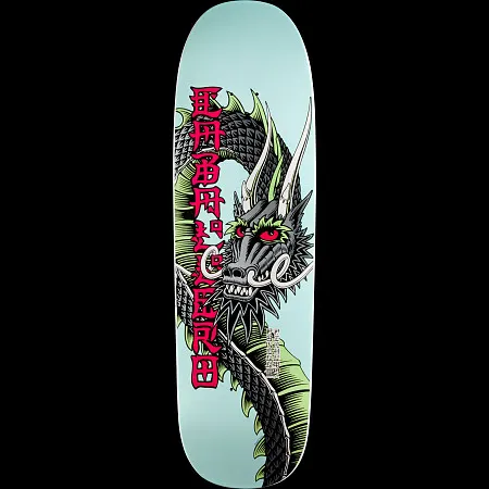 Powell Peralta Caballero Ban This Dragon White skateboard deck: Grey scaled dragon with white horns, red eyes and green fins coiled down a pale blue shaped deck, with red Asian-style lettering alongside it.