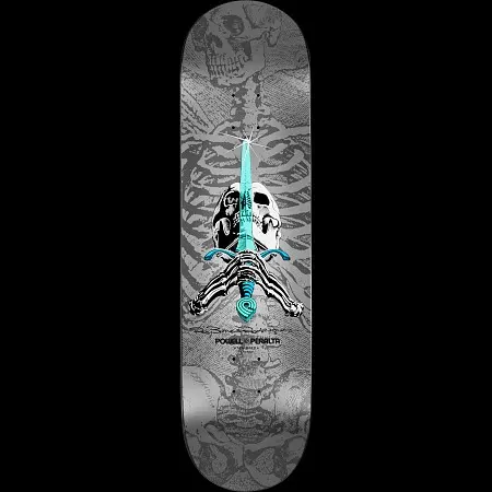 Powell Peralta Ray Rodriguez Skull & Sword "NOW"Silver skateboard deck: A skull and skeletal hands gripping a teal sword upright through its centre, over a large grey rib cage and skull pattern covering a silver deck. The Powell Peralta logo is printed below.
