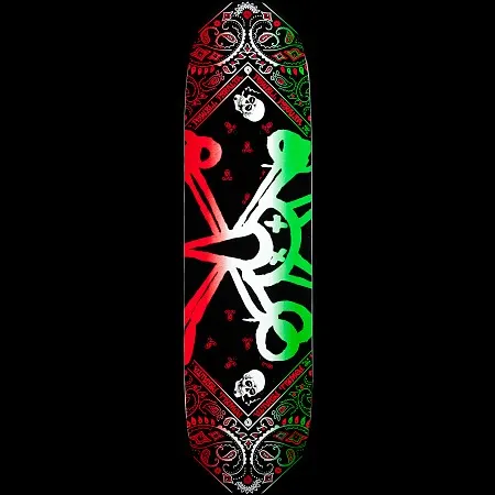 Powell Peralta Vato Rat Band Green skateboard deck: A Vato Rat skull and crossed-bones design in a red-to-green gradient, with the skull's eyes crossed out, on a black deck. It is bordered by a bandana-style paisley pattern with small skulls and Powell Peralta lettering around the edges.