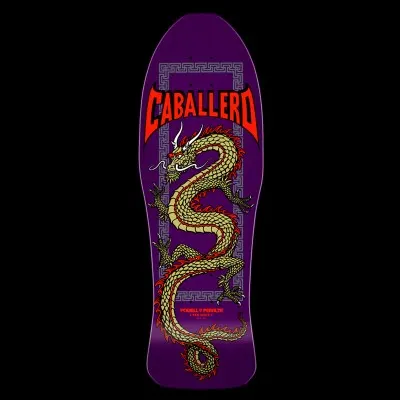 Powell Peralta Caballero Chinese Dragon - Purple skateboard deck: A long gold and red Chinese dragon coils down the deck within a Greek-key style border, under a large red 'Caballero' banner in a pointed, bat-wing lettering style.