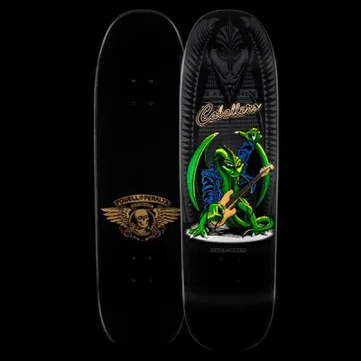 Powell Peralta Caballero Guitar - Black skateboard deck: A green dragon in a blue jacket plays a bass guitar on a round stage, with a large dark dragon head and spiked pattern behind it. Signature-style script name at the top; underside has a winged skull logo.