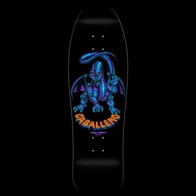 Powell Peralta Caballero Mechanical Dragon - Metallic Green skateboard deck: A robotic, mechanical dragon with metallic blue and purple plating and bat-like wings crouches above orange 3D lettering, on a black deck.