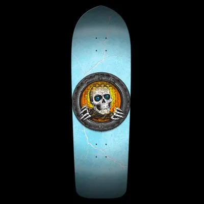 Powell Peralta Pool Light Ripper Large - Orange skateboard deck: Old-school shaped deck with a round metal-rimmed medallion at centre showing a skull with blue eyes and skeletal hands against an orange and yellow brick pattern. Light blue ground with white crack or lightning lines.
