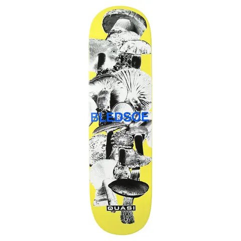 Quasi Bledsoe Mush skateboard deck: Yellow deck with a stacked black and white photographic collage of many different mushrooms running down the board. Bledsoe in blue sans-serif capitals across the middle, Quasi label at the tail.