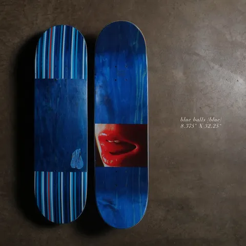 Quasi Blue Balls8.375 - Blue skateboard deck: Blue-stained deck with a close-up photograph of red lips and a tongue across the middle. The underside has blue and white vertical stripes with a small pair of blue hanging balls.