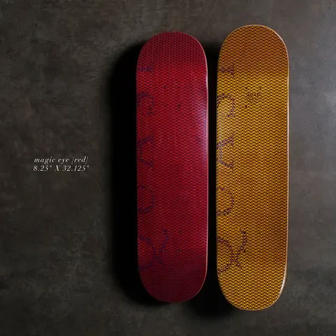 Quasi Magic Eye8.25 - Red skateboard deck: A fine zigzag op-art pattern covering the deck, with faint purple lettering underneath, shown in red and in yellow versions side by side. A caption names the red one as magic eye.