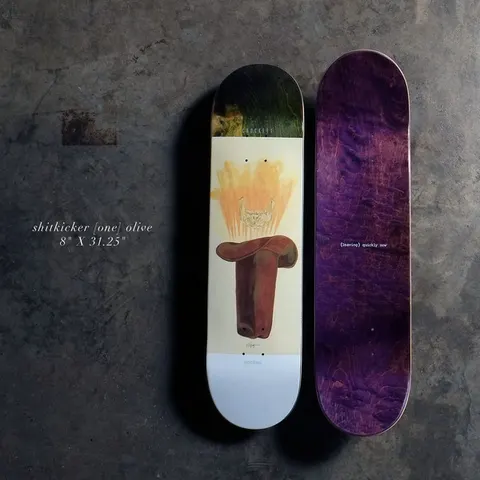 Quasi Shitkicker 8 - Olive skateboard deck: Painted brown cowboy boot topped with a flaming orange burst and a faint sketched skull on a cream deck with a green stained nose and white tail. The bottom is shown beside it in purple with small text.