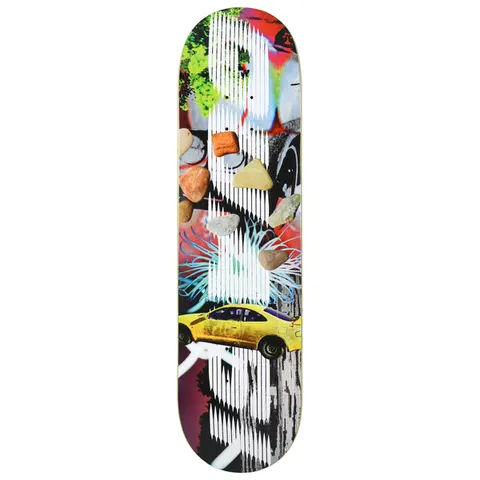 Quasi Gas Station skateboard deck: A collage of a yellow sports car, scattered pebbles, a sea anemone and graffiti-like colours, overlaid with vertical white line striping. The colourful pieces run along a tall white shape.