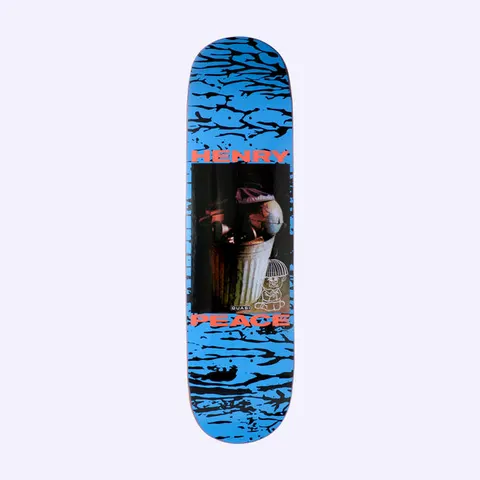 Quasi Henry Hope skateboard deck: A photograph of a dented metal dustbin stuffed with rubbish and a globe-like object sits in a black panel on a blue deck with black cracked-water pattern. Henry and Peace are printed in red above and below, with a small teddy-bear outline.
