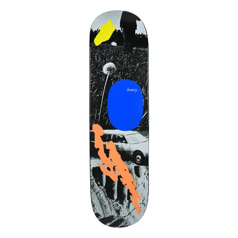 Quasi Henry Lawnmower skateboard deck: A black and white photo of a dandelion in tall grass and an estate car, with painted blobs of yellow, blue and orange laid over it. The blue oval holds the word 'henry.' in white.