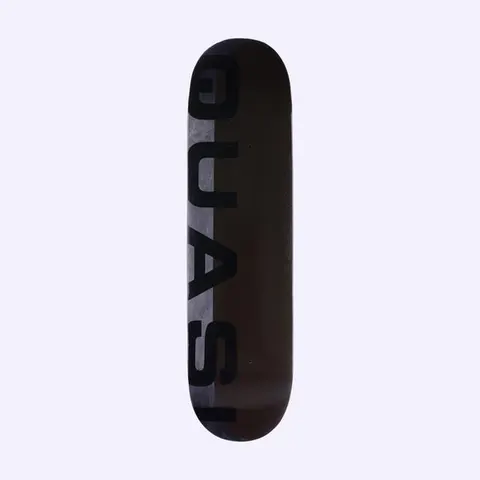 Quasi Mono Phade Black skateboard deck: Large black capital letters spelling Quasi run vertically down the left side, over a split background of grey fading panel and a dark brown-black field.
