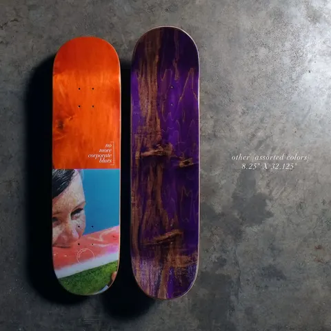 Quasi Other8.25 - Assorted skateboard deck: Photographic graphic of a freckled girl biting into a slice of watermelon on the lower half, under a bare orange-stained upper half with small serif text. A second deck shows a plain purple stained underside.
