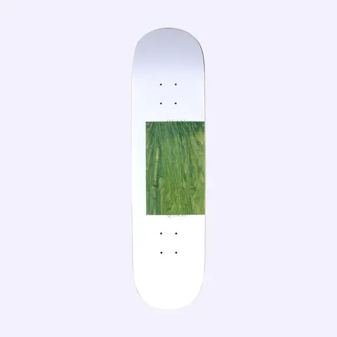 Quasi Proto 1 skateboard deck: A white deck with a rectangular panel of green-stained wood grain in the lower middle, with very faint Quasi lettering above and below the panel.