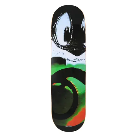 Quasi Scrambled skateboard deck: Distorted, glitchy cropped image of a cartoon cat's big eyes and face above green, black and orange swirling shapes, in the manner of a scrambled TV signal. Small Quasi label at the tail.