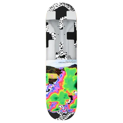 Quasi Zoom Out skateboard deck: Top half is a pixelated black-and-white cross or QR-like pattern over a grey metallic image with a magnifier icon; below, a landscape photo of hills merges into a thermal-imaging style blob in green, pink and purple. Small italic caption between.