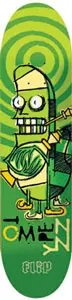 Flip Ace Of Spades skateboard deck: A cartoon green pickle-like character with wide eyes and bared teeth playing a trumpet, on a green deck with concentric circles at the nose, the rider name in blocky letters along the side and the Flip logo at the tail.