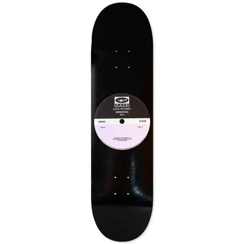 Skateboard Cafe 45 Black/Lavender skateboard deck: Deck designed as a vinyl record with grooves and a centre label in black and lavender reading Live Studio Sessions Vol.2, with a Cafe trumpet logo and small print.