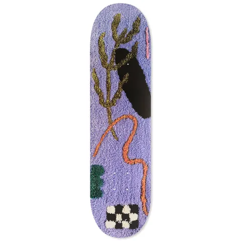 Skateboard Cafe April - Lavender skateboard deck: Lavender tufted-rug style artwork with a gold plant stem, a black oval, a wavy orange line, a green scalloped shape and a black and white checkerboard patch.