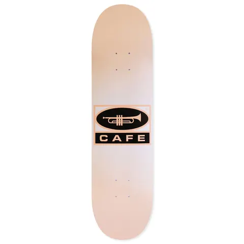 Skateboard Cafe Trumpet Logo - Peach/White Fade skateboard deck: Peach-to-white faded deck with a central black oval containing a trumpet, above a black bar reading CAFE, all in a peach-outlined rectangle.