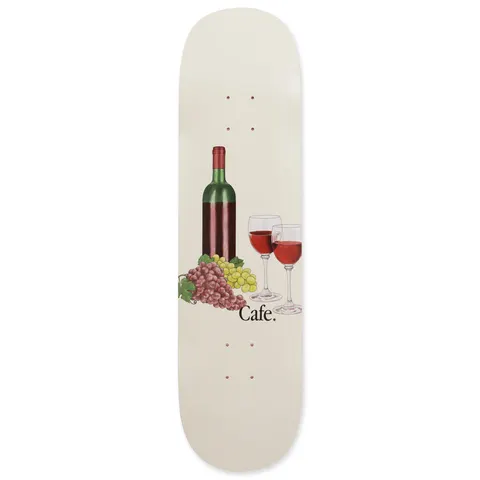Skateboard Cafe Vino - C2 Shape Cream skateboard deck: A wine bottle, two glasses of red wine and bunches of red and green grapes in a still life on a cream deck, with the Cafe wordmark in black beside the grapes.
