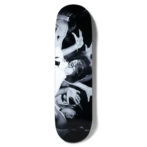 Girl Spike Photo Series V2 Karen O skateboard deck: A black-and-white live-music photograph, turned sideways along the deck, of a singer with dark hair screaming into a microphone while a crowd's hands reach towards her.