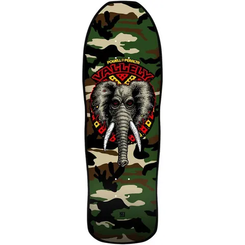 Powell Peralta Mike Vallely Elephant Camo skateboard deck: A grey elephant head with white tusks and red eyes sits within a red and yellow tribal burst, with the rider's name arched above. The deck has a green and brown woodland camouflage pattern.