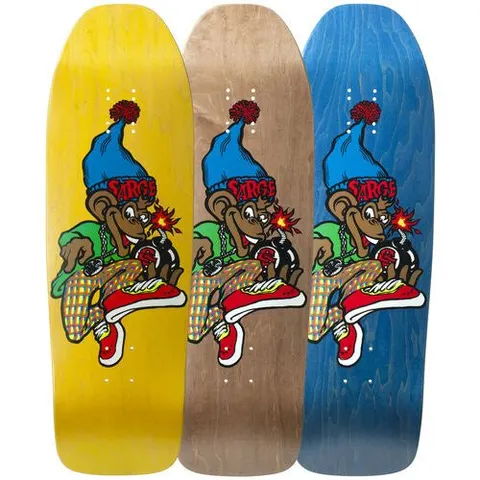 New Deal The Sargent Monkey Bomber Screenprinted skateboard deck: Cartoon monkey in a blue bobble hat marked SARGE, green top and checked trousers, sitting with a lit bomb and red trainers. Shown in three stain colourways: yellow, natural and blue.