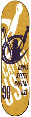 Capital Victory skateboard deck: Mustard yellow deck with a purple silhouette of a figure with raised arms inside a swirl, large white Capital USA lettering behind, and black text naming Chris Keeffe, Capital USA and 98.