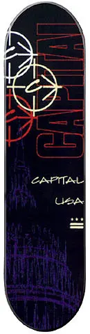 Capital Team skateboard deck: A dark navy and black deck with large red Capital lettering up the right side, overlapping white and red crosshair-style circles with a C at the top, and a faint purple Capitol building behind. Small cream text and a striped flag mark below.