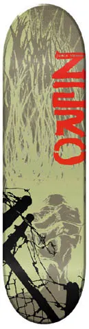 Zero Caged skateboard deck: Olive-green deck with tall grey grasses at the top, a faint grey figure, and black barbed wire and fence posts at the bottom left. Large red distressed lettering runs up the right side.
