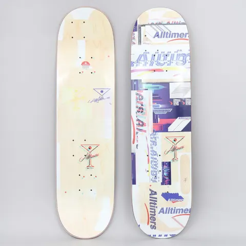 Alltimers Glitch Natural skateboard deck: Both sides shown. The top is a collage of glitchy, overlapping Alltimers logos, cityscape images and martini glass marks in purple, red and cream, on a natural wood deck. The underside carries faint martini glass logos.