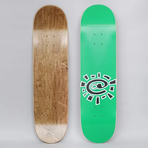Always @Sun Green skateboard deck: A green deck with a black and white outlined sun made from an @ symbol, with short rays around it. Both the top graphic and the bare wood underside are shown.