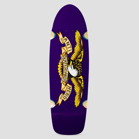 Anti Hero Shaped Eagle Caster Purple skateboard deck: Classic Anti Hero eagle with spread yellow wings and a scroll banner reading Anti Skateboards Hero, on a plain purple deck. Cream-coloured caster wheel shapes show at the edges.