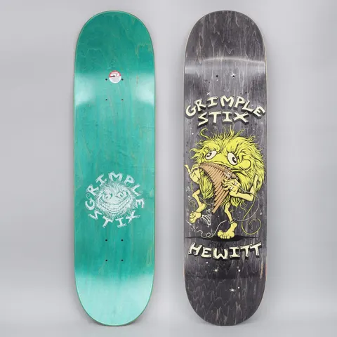 Anti Hero Grimple Hewitt Family Band skateboard deck: Hairy yellow Grimple creature with wide eyes playing a pan flute, with stars around it, on a black-stained deck. Cream lettering above and below. Teal underside with a grinning Grimple Stix logo also shown.