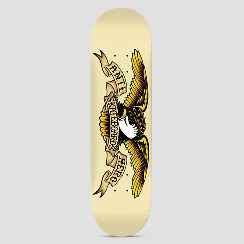 Anti Hero Classic Eagle Cream skateboard deck: A traditional tattoo-style eagle with spread yellow and brown wings and a white head, wrapped by banners reading Anti Skateboards Hero, on a cream deck.