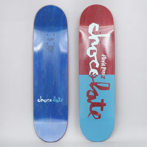 Chocolate Stevie Perez Original Chunk Red / Navy skateboard deck: Deck split in two halves, red-stained at the top and light blue below, with the Chocolate chunk logo in large hand-cut lettering that changes colour across the split. 'Stevie Perez' written in small script beside it.