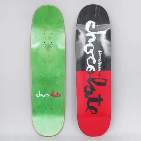 Chocolate Kenny Anderson Original Chunk Black / Red skateboard deck: A deck split into a black top half and a red bottom half, with large white and black brush-style Chocolate lettering running down it and the rider name in small white script. The underside is green with a small logo.