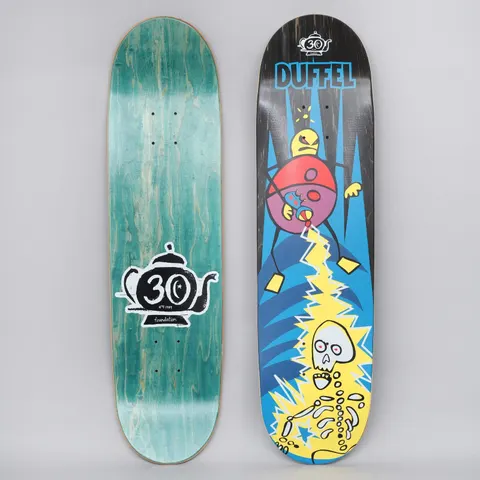 Foundation Duffel Phaser skateboard deck: Cartoon of a round purple and red creature with a yellow head zapping a yellow-outlined skeleton with a lightning bolt against a blue spiky background. Duffel name in blue at the top with a 30th anniversary teapot logo; bottom view shows teal stain with a large teapot logo.