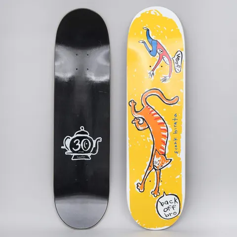 Foundation Hirata Back Off skateboard deck: Yellow deck with a naive cartoon of a stretching orange cat and a falling skater shouting Woof, with speech bubble reading back off bro. Frank Hirata name written in blue. Bottom view shows black stain with white teapot 30 logo.