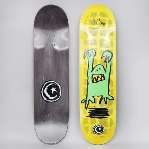 Foundation Merlino Monster Yellow skateboard deck: Crudely drawn green monster with raised claws and a jagged-toothed mouth on a yellow-stained deck with scribbled grey marks, with the Foundation star and moon logo below. Bottom view shows black stain with large logo.
