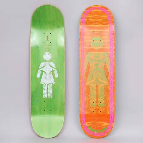 Girl Griffin Gass Vibrations OG skateboard deck: Girl's OG woman-symbol silhouette filled with a rippling, vibrating wood-grain pattern in green and orange, inside a pink dashed oval border. Orange background; the green underside carries a white version of the figure.
