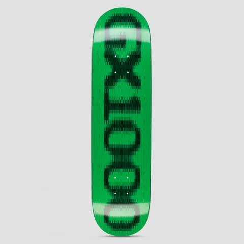 GX1000 OG Logo Blur Green skateboard deck: The GX1000 logo in dark green lettering running up the deck, pixelated and blurred as if out of focus, on a bright green background.