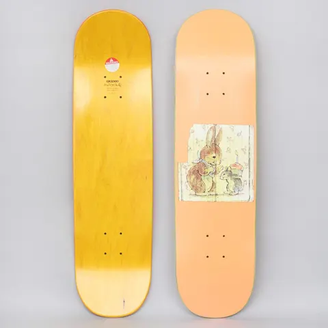 GX1000 Bunny Peach skateboard deck: Peach deck with a small vintage storybook-style illustration of a rabbit and a mouse holding a lit candle on a cupcake, set in a torn-edged panel. A yellow stained underside with GX1000 logo is also shown.