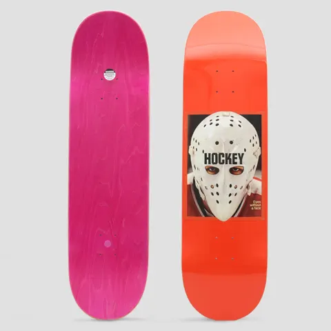 Hockey War On Ice Red skateboard deck: Photograph panel of an ice hockey goalie in a white perforated mask staring through the eyeholes, on an orange-red deck. Hockey logo across the mask and the caption 'Eyes without a face'.