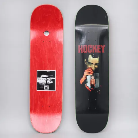 Hockey Andrew Allen Point Break Black skateboard deck: Photographic scene on black of a man in a rubbery mask pulling a small figure on a string from a red-lit hand, with 'HOCKEY' in red letters above. The reverse is red stain with a small black and white 'Andrew Allen' photo label.